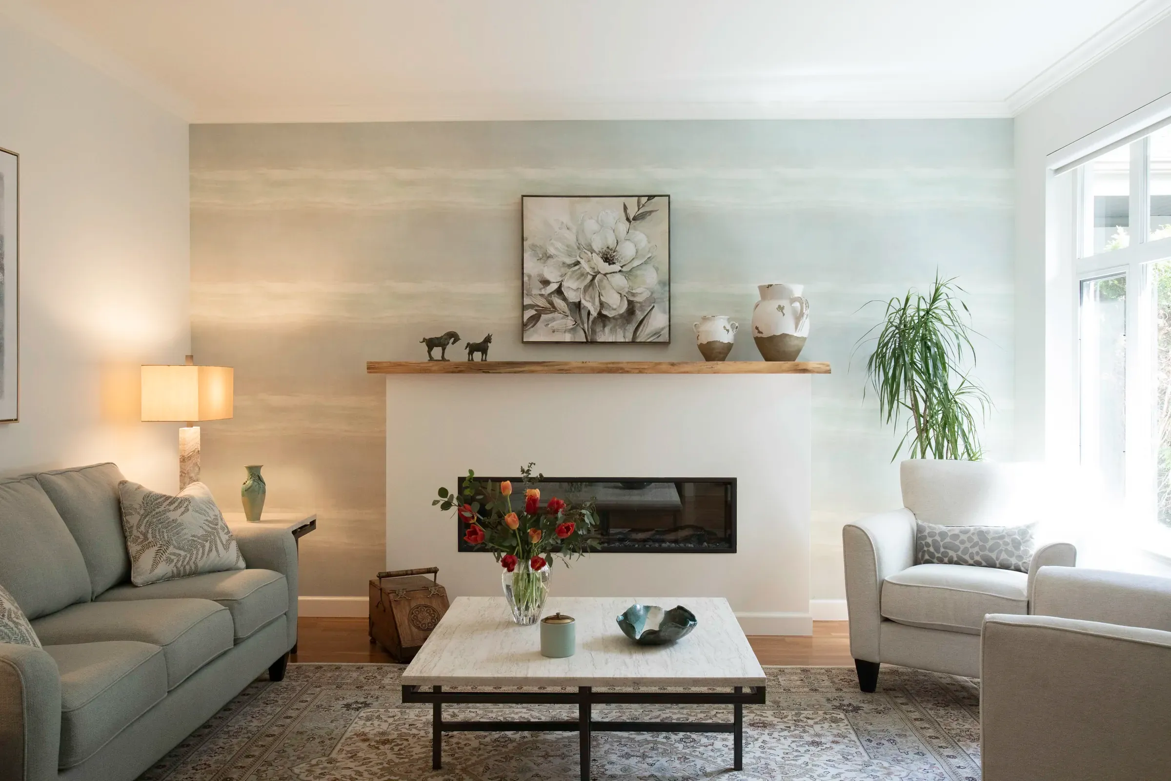 Finished living room centred on a modern fireplace